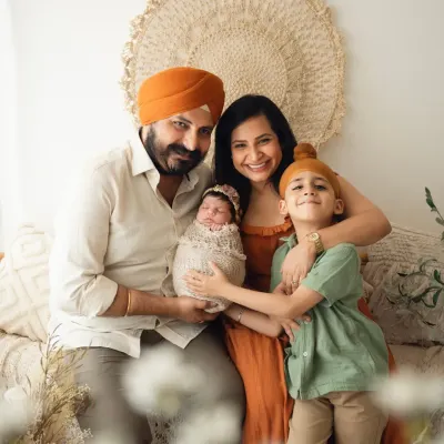 A beautiful family portrait with their new baby girl. I love capturing the joy and pride of the whole family, including excited older siblings.