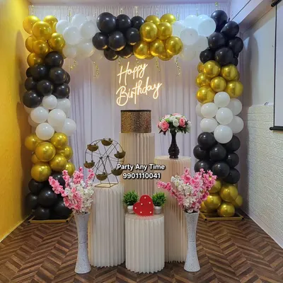 A classic black, white, and gold balloon arch setup in my Kanakapura party hall, complete with plinths and a neon sign. This package is available at a great price.