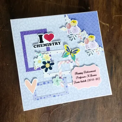 The cover of a retirement scrapbook for a chemistry professor, personalized with her name, batch years, and "I Love Chemistry" sticker.
