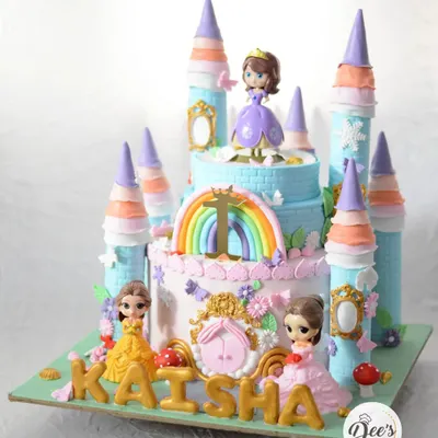 A princess castle cake fit for royalty. This grand, multi-tiered creation features towers, rainbows, and beloved princess figurines, making it the ultimate centerpiece for a fairytale birthday party.