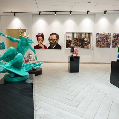 An overview of our gallery space. Pop artworks bring color and energy to the walls, while sculptural pieces ground the room, creating a design-led aesthetic.