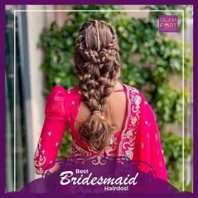 This intricate braided hairstyle is perfect for a bridesmaid or for a sangeet ceremony. It keeps the hair off the face while still looking incredibly detailed and beautiful.