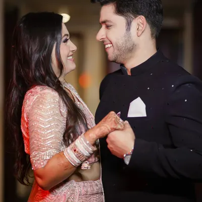 The best moments are the unposed ones. Here, a shared laugh between the couple during their engagement shoot shows their genuine connection and happiness, which is exactly what we love to capture.