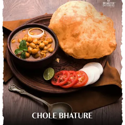A classic North Indian favourite, Chole Bhature. The fluffy, deep-fried bhatura is the perfect companion to our spicy and flavourful chickpea curry.