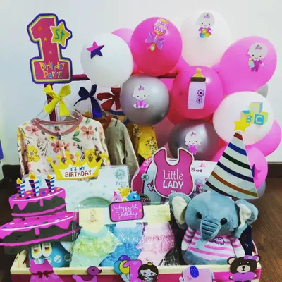 Celebrating a huge milestone! This hamper is for a little lady's 1st birthday party. It's packed with a party hat, a birthday cake cutout, a plush elephant, and a variety of outfits to mark the special day.
