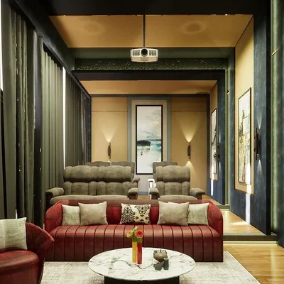 A classical home theatre in "Yash Villa," featuring tiered seating with plush recliners and a sofa, all set within a richly textured room.