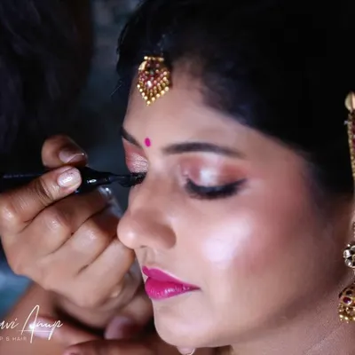 A behind-the-scenes moment showing the precision of eyeliner application. A sharp, clean wing is a key element for many of my bridal looks, defining the eyes beautifully for the camera.
