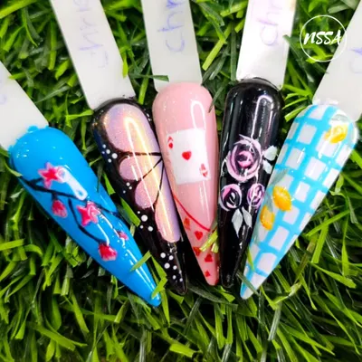 I am so proud to display this collection of designs from our students. It shows their mastery of different techniques, including hand-painting cherry blossoms, butterflies, playing cards, and checkered patterns.