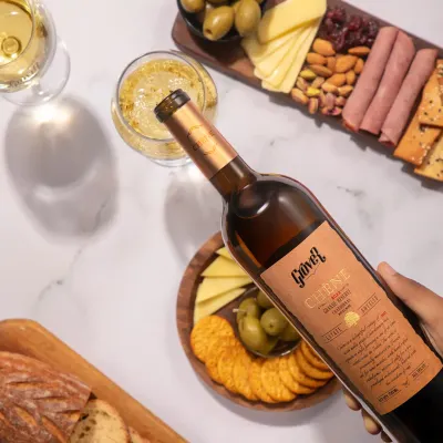 An ode to a timeless pairing. Our oak-aged Chêne Grande Reserve, a complex Cabernet Shiraz, is poured alongside a carefully selected charcuterie board. This is the kind of indulgent moment I design for my guests.