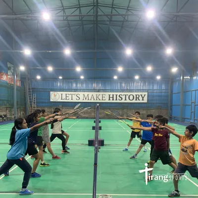Young badminton players learning proper technique at the net during a coaching session at our Dwarka Sector 10 centre. Discipline and fun go hand in hand in our academies.