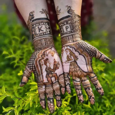 This custom engagement mehendi tells a love story with a portrait of the proposal. I also included the couple's initials, 'K' and 'P', inside decorative frames topped with peacocks.