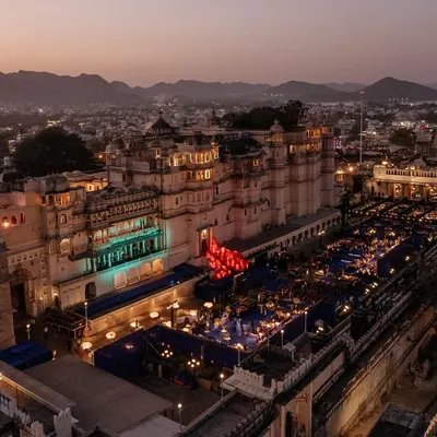 An epic aerial shot of a Sangeet at Manek Chowk, Udaipur. We transformed the historic space into a modern celebration arena, with the palace facade as a backdrop for an unforgettable night of dancing.
