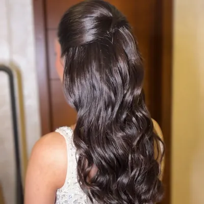A beautiful half-up, half-down hairstyle with soft, voluminous waves. This look is created without crimping to give it a natural, healthy bounce.