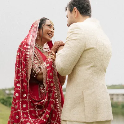 A candid moment of pure happiness between the bride and groom. Her joyful laugh and the way they look at each other is what we love to capture, the real connection that needs no posing.