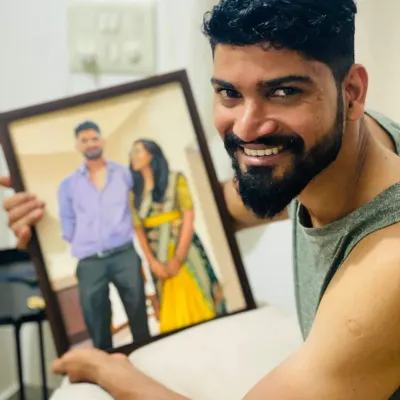 A happy client with his custom couple's portrait. His smile says it all. It's moments like these that make my work so fulfilling.