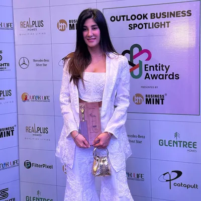A proud moment accepting the 'Stylist of the Year' award from Outlook Business Spotlight. For the event, I wore a beautiful white embroidered co-ord set from Mishru.