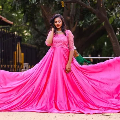 This is my most popular rental gown for photoshoots. The extra-long, flowing pink fabric creates stunning, dramatic pictures every time.