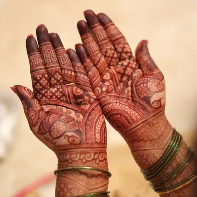 This is the beautiful, fresh stain on the second day after the henna paste was removed. The color is already developing into a rich reddish-brown, a sign of high-quality natural henna.