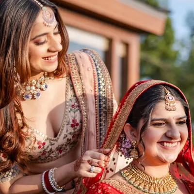 Some bonds don’t just witness your story, they become the story itself. A sister adjusting the bride's veil is a perfect example of the quiet, beautiful moments that make a wedding timeless.