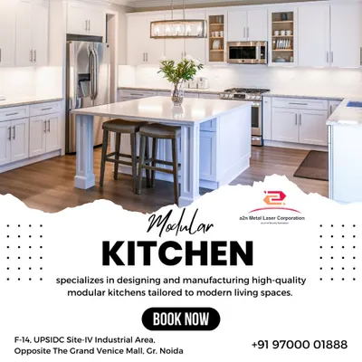 A stunning, all-white modern modular kitchen with a large central island that doubles as a breakfast bar. This design exemplifies luxury and functionality, with ample cabinet space and a clean, bright aesthetic.