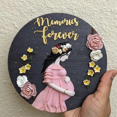 A perfect way to imprint memories forever. This custom wall art was created for an expecting mother, celebrating a beautiful milestone with delicate, hand-sculpted flowers.