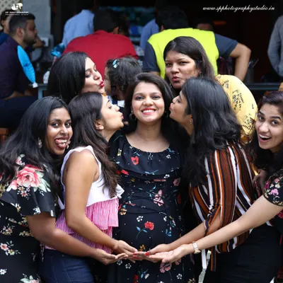 A baby shower is a joyous celebration with friends and family. We capture the fun, candid moments like this one, preserving the memory of the love and support surrounding you.