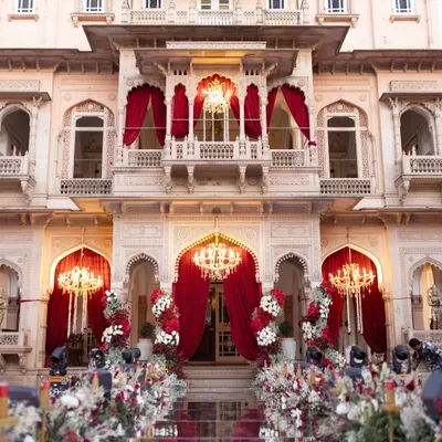 The grandeur of Chomu Palace provided the perfect canvas for this iconic wedding evening. I used rich red drapery and magnificent chandeliers to accentuate the palace's heritage architecture, creating an atmosphere of pure royal elegance.