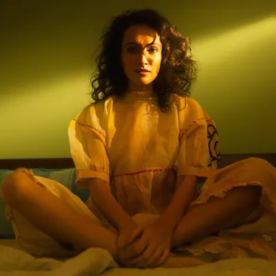 A key example of my cinematic lighting style. We used a single, hard light source to create this artificial sunbeam, bathing actress Dipannita Sharma in a warm, story-rich glow.
