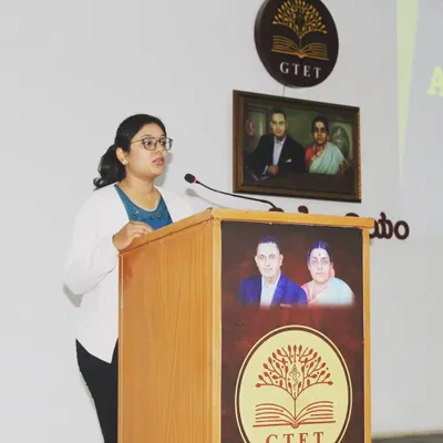 Speaking at an awareness program for young adults about acne and hair loss. It's crucial to educate them on basic care and the importance of seeking early treatment.