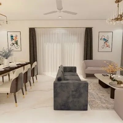 A complete view of the living and dining space designed for a home in ATS Pristine, Noida. We used a mix of comfortable seating, elegant chandeliers, and a statement mirror wall to create a space that is both glamorous and welcoming for family and guests.