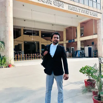 Here I am outside the District Court Rohini. Success in the legal field comes from being dedicated and consistently present where the work happens.