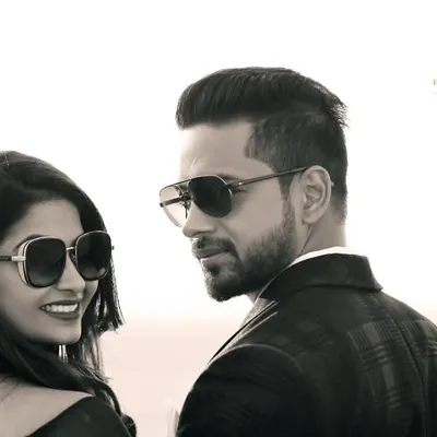 A classic black and white portrait with a cool, retro vibe. Their sunglasses and confident expressions give this shot a timeless sense of style, like a still from a classic film.