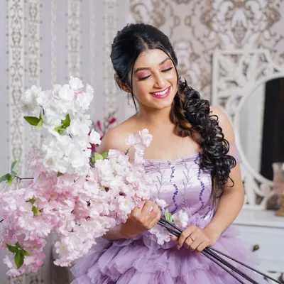 Our lavender ruffle gown paired with a bouquet of cherry blossoms against our vintage damask wallpaper and vanity set. This setup is perfect for romantic, whimsical photos.