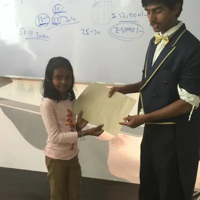 One of my favorite moments. This young magician has just completed the beginner magic class and is receiving her magician-in-training certificate. It's a proud moment for both of us.