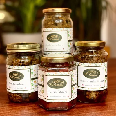 A small batch of my best-selling pickles, including Aam ka Achaar, Bharwa Mirchi, Ghissu Aam ka Achaar, and Amla ka Achaar. These were sent to the US as special Christmas gifts from a proud daughter to her friends.