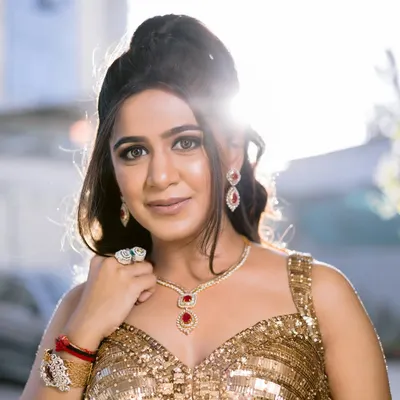 Backlit and beautiful, this bride is ready for her Sangeet. I created a golden goddess look with shimmering makeup and a voluminous hairstyle to match her spectacular sequined lehenga.