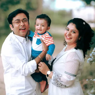 A beautiful family portrait captured during a lifestyle session in a park. The genuine smiles and laughter are what make these outdoor shoots so full of life and energy.
