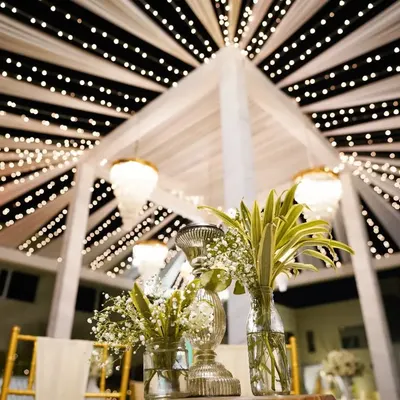 A stunning shot of the wedding decor at a destination wedding in Ranthambore. The canopy of fairy lights creates a magical, starry night effect for the celebration.