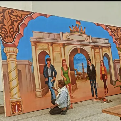 Here I am putting the finishing touches on a large mural for a German Embassy event in New Delhi. The piece blends Indian and German cultural elements.