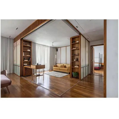 The 'Ikigai House' features large, sliding partitions that can completely transform the layout. Here, a study and lounge area is revealed, seamlessly integrated with the main living space, yet able to be closed off for privacy.