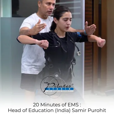 I'm working with Sara Ali Khan to fine tune her form during an EMS workout. Each session is personalized to ensure maximum muscle engagement and safety.