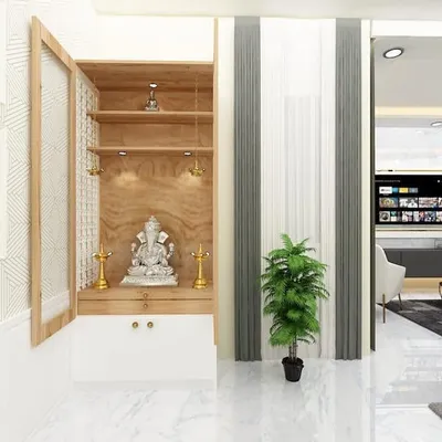 A beautifully crafted pooja unit with a wooden finish and cabinet doors. The design is modern yet reverent, providing a dedicated space for prayer and reflection within the home.