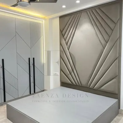 A true masterpiece of craftsmanship. This bedroom features a floor-to-ceiling headboard with a stunning geometric, Art Deco-inspired upholstered design, creating a dramatic and luxurious focal point.