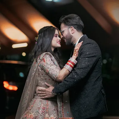 A romantic night shot of a couple ready for their reception. We use lighting to create a cinematic feel for your evening event photography.