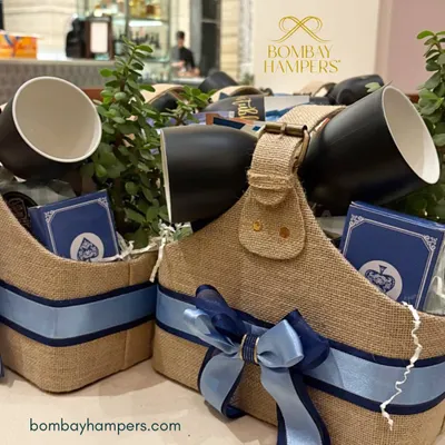Elevate your brand's hospitality with these curated experience hampers. Packed in rustic jute baskets, they include mugs and playing cards, perfect for leaving a lasting impression on international clients and guests.