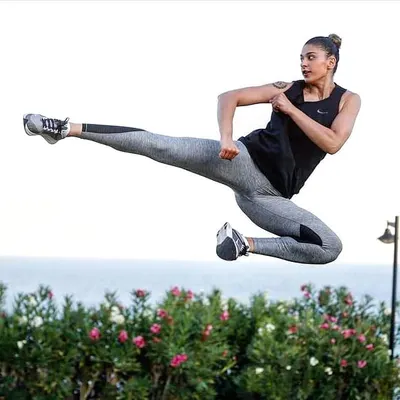 A powerful flying side kick, demonstrating the explosive strength and agility we develop in our kickboxing and taekwondo sessions. This is about learning what your body is capable of.