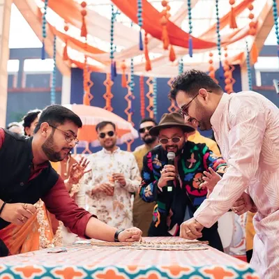 A high-stakes card game between the bride and groom's side at a Haldi in Jaipur. The competitive spirit and laughter make these games a highlight of the wedding.