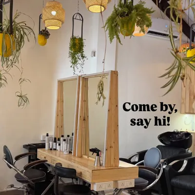 Welcome to Mad O Wot. I wanted to create a space that felt like an escape, filled with plants, natural light, and good energy. Our salon stations are made from reclaimed wood, surrounded by greenery to make your visit as relaxing as possible.