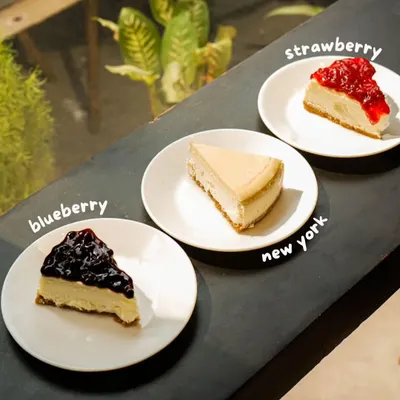 It's a season of cheesy affairs. Here are three of our signature eggless cheesecakes: the tangy Strawberry, the classic Blueberry, and the rich, unadulterated New York style.
