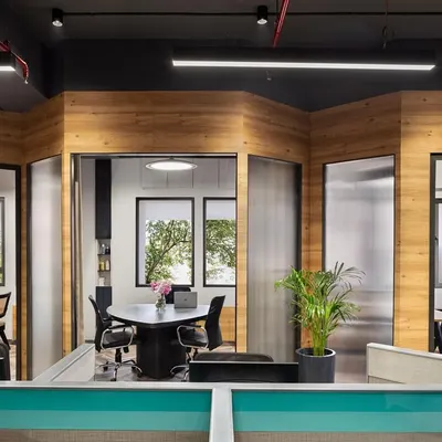 We crafted this streamlined, clutter-free workspace for Aromasphere with functionality in mind. Angular partitions carve out chic walkways, offering privacy without blocking natural light and encouraging team interaction.